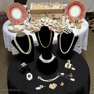 Fine jewelry selection showing pearls, Omega gold and diamond watch, Chanel cuff and more