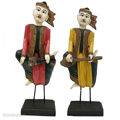 Pair of polychrome painted wooden Thai musicians, playing native Thai instruments; 27 inches and 26 inches tall