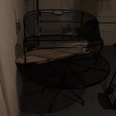 HARD TO SEE IN PHOTO BUT THIS IS THE WROUGHT IRON TABLE AND BENCH