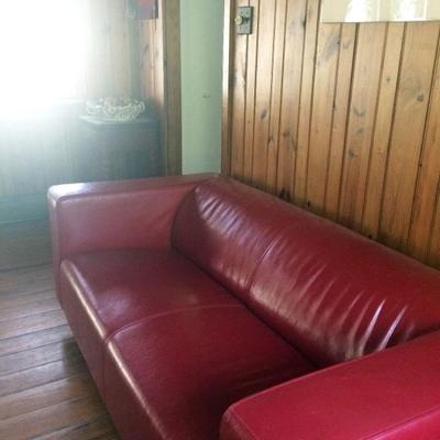 Detail of red leather Ikea couch