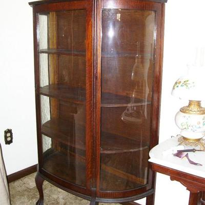 One of 2 curved glass china cabinets
