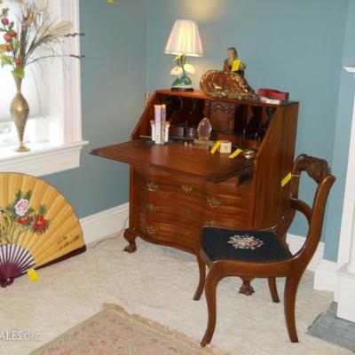 mahogany slant front desk, rose back chair w/needlepoint seat, chalkware lamp and lady figurine, etc.