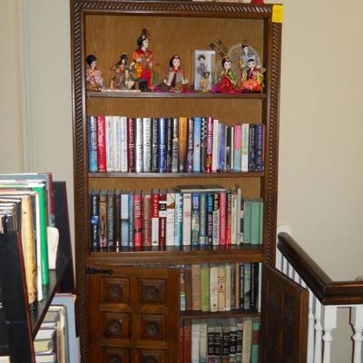 bookcase, books, dolls, etc.