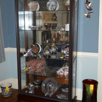 lighted curio cabinet, glassware, plates, etc.