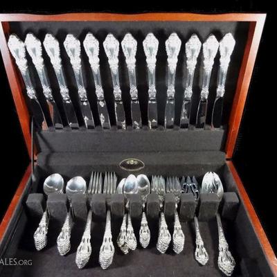 63 PIECE STERLING SILVER FLATWARE BY LUNT, IN THE BAROQUE ELOQUENCE PATTERN