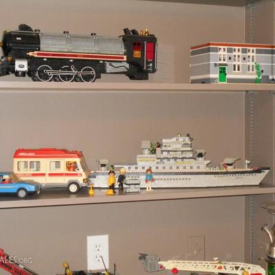 Many toys and games including extensive LEGO collection and sculptures.