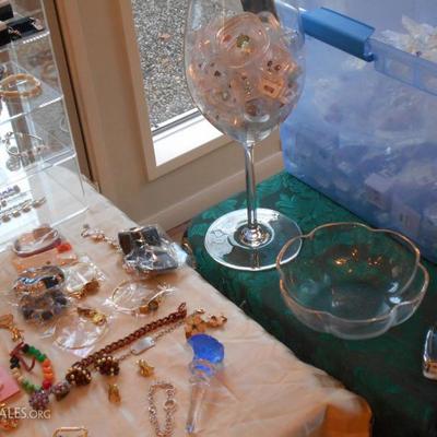 Many loose gemstones in display boxes and fine crystal