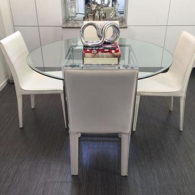 Modern glass and chrome table with four white leather chairs in pristine condition
