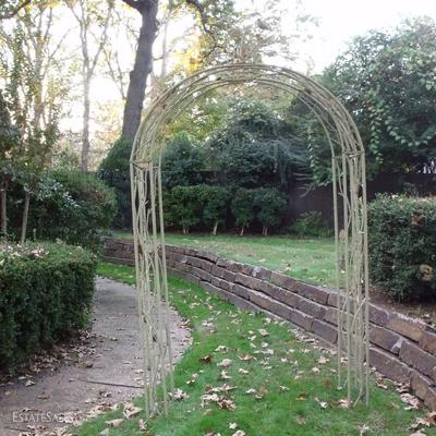Wonderful wrought iron garden arch with bird/branch topper.