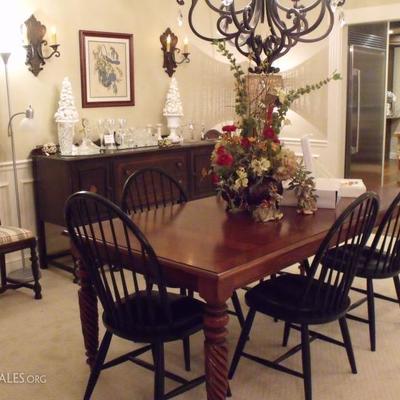 Ethan Allen dining table with 6 chairs and 1 leaf.