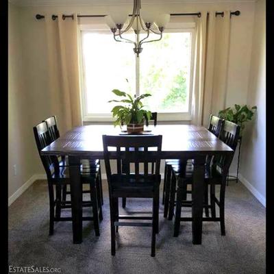 Rustic style barnwood high top table with 6 chairs.