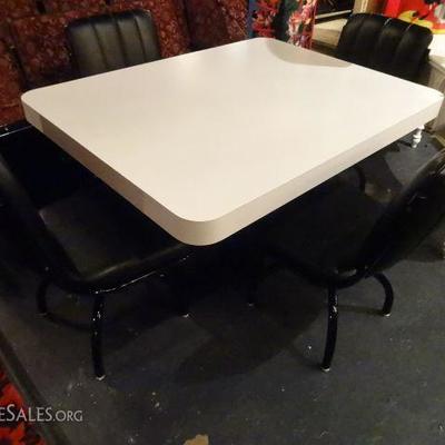MODERN WHITE MICA DINING TABLE WITH BLACK BASE AND BLACK CHAIRS