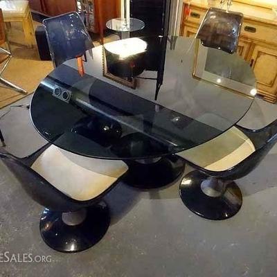 1970's SMOKE ACRYLIC DINING TABLE WITH BLACK GLASS TOP AND 4 ACRYLIC SWIVEL CHAIRS