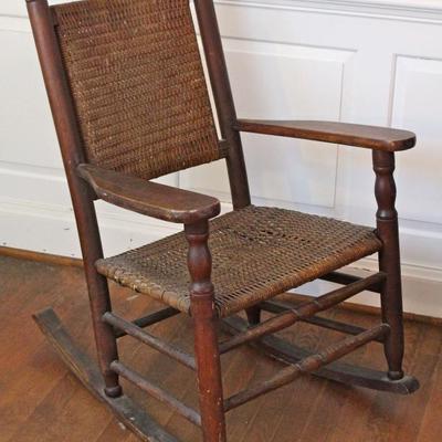 antique oak rocking chair with woven seat and back