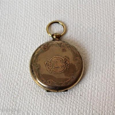 locket with fading photos