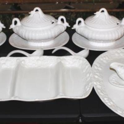 Box lot of white china with three swan travines with soup ladles and platters, cake stand, gravy boat, two large platters.
