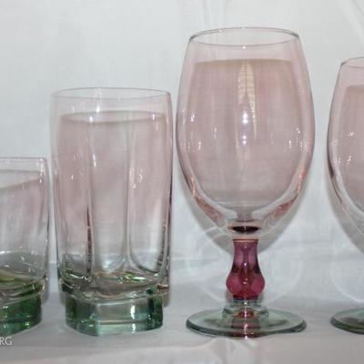 Set of 24 iridescent glassware. 7 red wine (Tall Round), 7 white wine (Shorter Round), 6 water (Tall Square), 4 tumblers.
