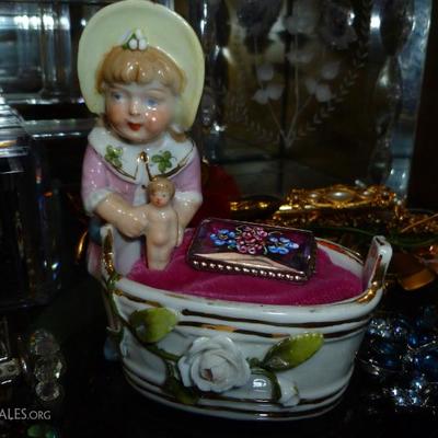 We turned this German porcelain figurine into a jewelry display.