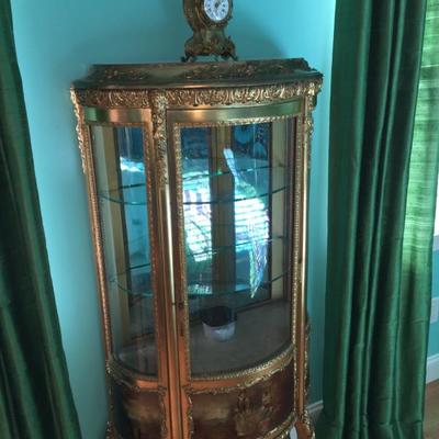 Lovely late 19th century serpentine Vernis Martin style French Vitrine Display Cabinet in gilded finish with glazed doors and interior...