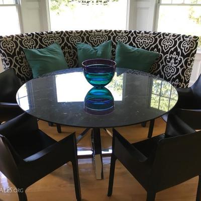 Marble top and chrome base dining table along with 4 Mario Bellini Cab Arm Chairs