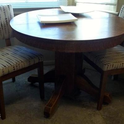Solid Oak Round Table
Two Upholstered Chairs