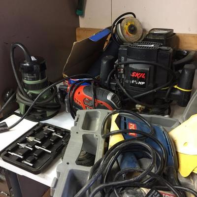 Many assorted power tools
