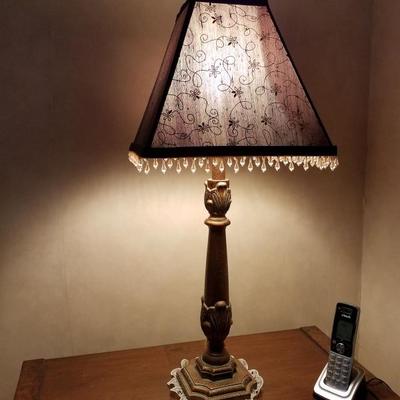 One of a pair of small fringed lamps