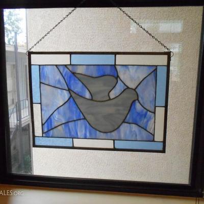 Many stained glass window hangings