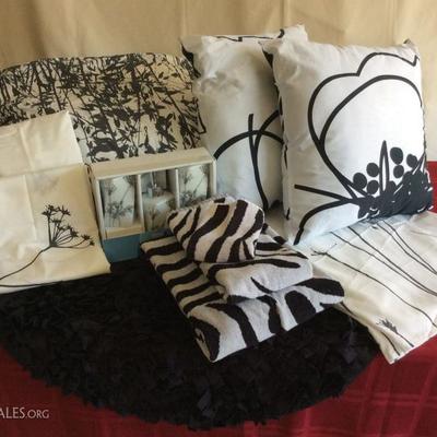 Lot # 5 Charcoal gray, black / white bed and bath ensemble.  Bed skirt, comforter, 2 pillow cases, 2 pillows, small round rug, 3 piece...