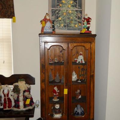 pine cabinet, Christmas tree w/lights flickering picture, Santas, etc.