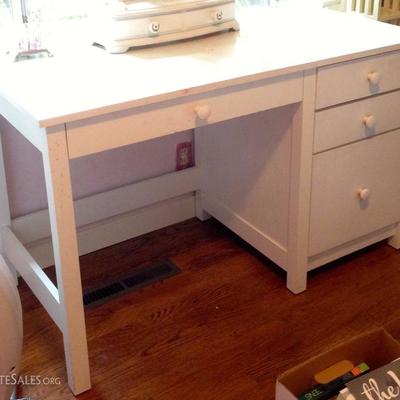 White painted wood desk. Includes a fold down drawer for keyboard and file drawer.
