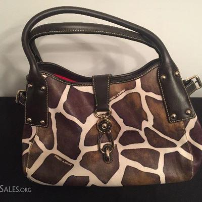 Authentic Dooney and Bourke with Signature Clasp in Giraffe Print. Like new.
