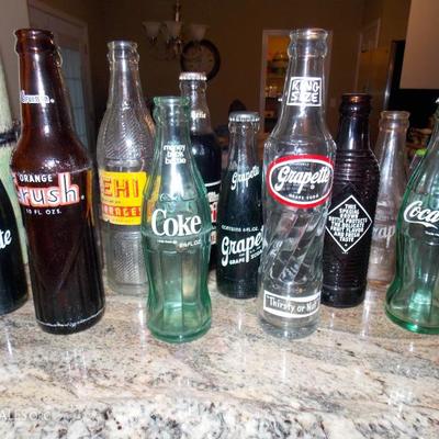 Soda bottle collection, some with contents still intact!