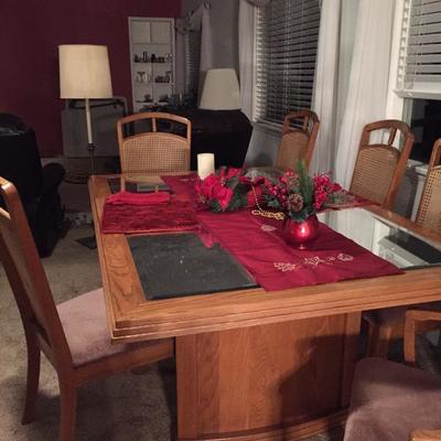 Dining table 2 leafs. 6 Chairs one is Captains. Very nice condition 