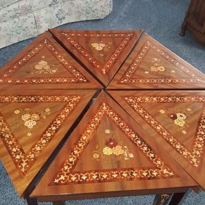 Amazing inlaid coffee table from Italy which has music boxes in each piece 