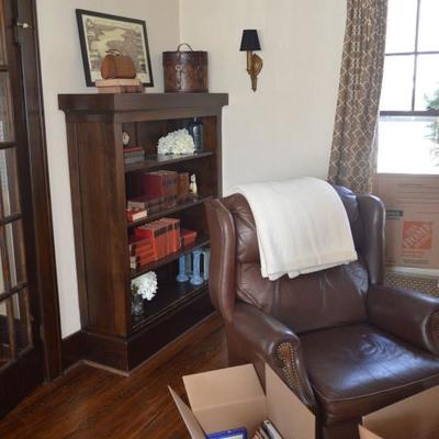 leather recliner, leather books, bookshelves are built in and stay with the house