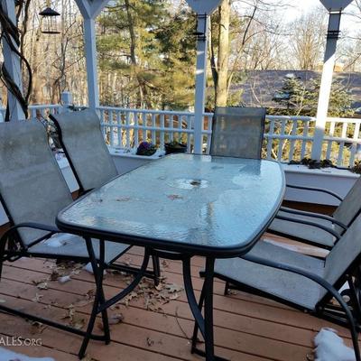 Glass patio table and six chairs