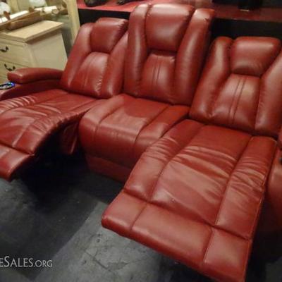 SEATCRAFT RED LEATHER ELECTRIC RECLINING SOFA WITH USB PORTS, CUPHOLDERS, 2 ELECTRIC OUTLETS, AND POP UP CENTER LIGHT IN MIDDLE HEADREST