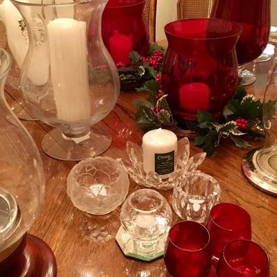 Candle collection with silver, glass and crystal holders -- including hurricanes, votives, and Crate and Barrel items. More than 300...