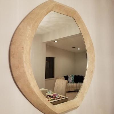 Stone-framed mirror