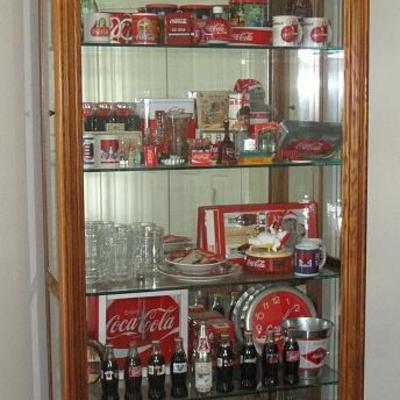 Pulaski Furniture Oak 5-Shelf Glass Lighted Curio Shown with a Portion of Coca Cola Collection