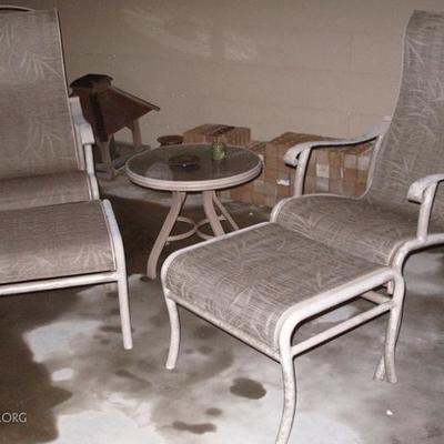 Cast Aluminum Sling Back Arm Chairs with Foot Stool.(2 ea.). Also shown Cast Aluminum Glass Top Round Side Table (2 ea.)