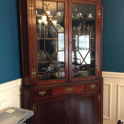 Early Corner Cabinet. Pediment not shown.