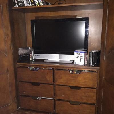 Armoire with flat screen and movies 