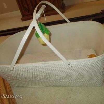 Adorable bassinet with stand.