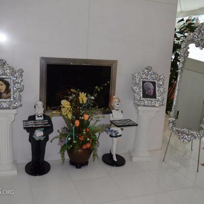 Swarovski crystal frames, butler and maid decor located in the entry way