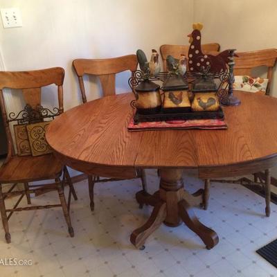 Antique Wood Table with 2 leaves and 5 chairs (1 chair not in photo)

