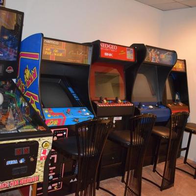 Arcade cabinets, including Mrs. PacMan, The Revenge of Doh and more!