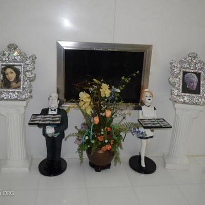 Swarovski crystal frames, butler and maid decor located in the entry way