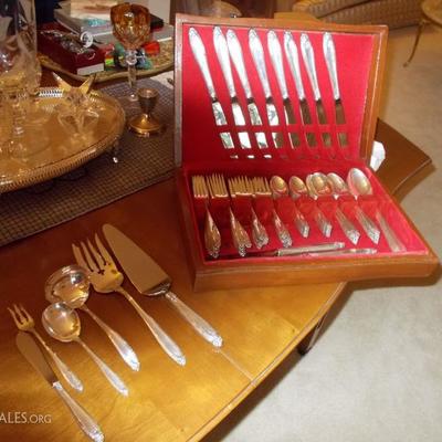   Prelude by International Sterling
12 five piece place settings equals 60 pieces
10 serving pieces
Total of 70 pieces $2,400
Silver...